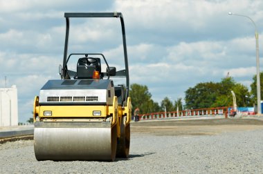 Compactor roller at road work clipart