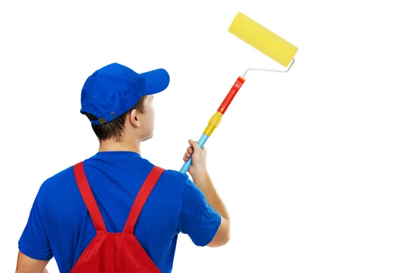 Painter man in uniform with paint roller — Stock Photo, Image