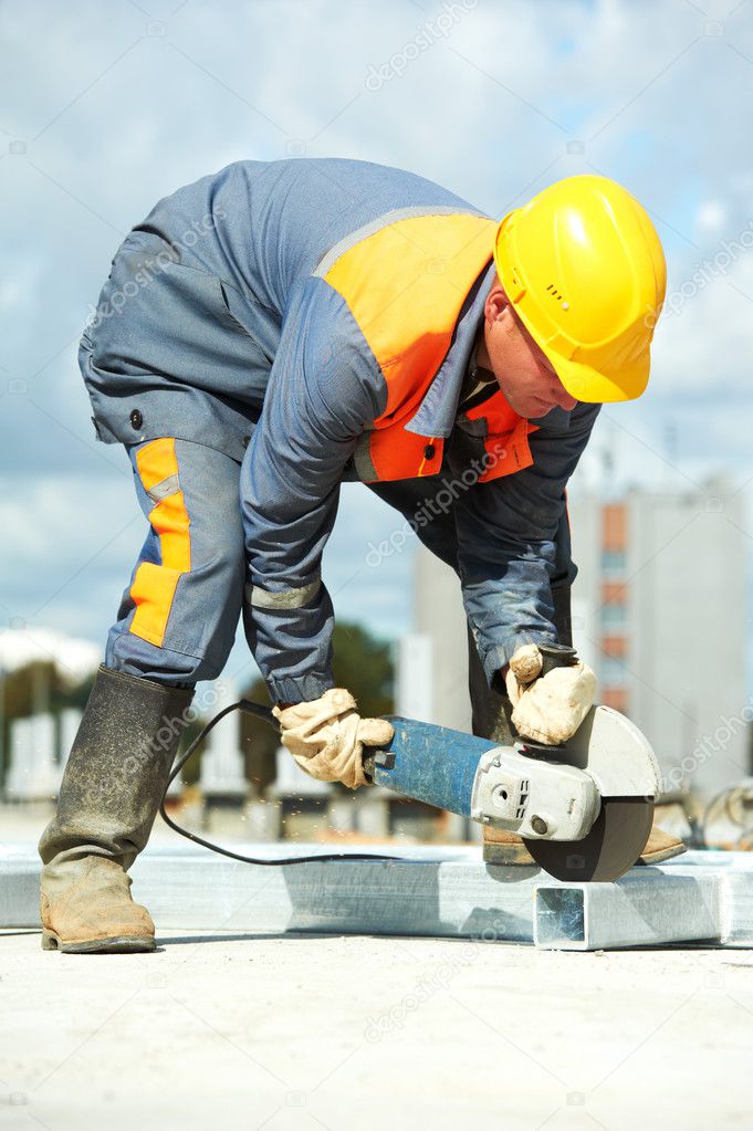 Builder working with cutting grinder