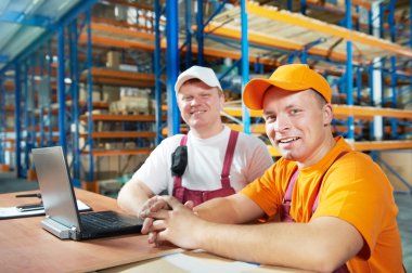 Manual workers in warehouse clipart