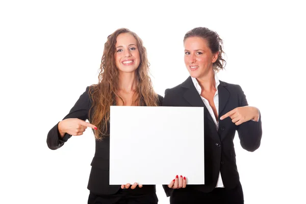 Mulheres de negócios segurando placa em branco — Fotografia de Stock