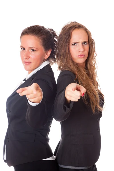 Dos mujeres de negocios señalando sus dedos en la cámara — Foto de Stock
