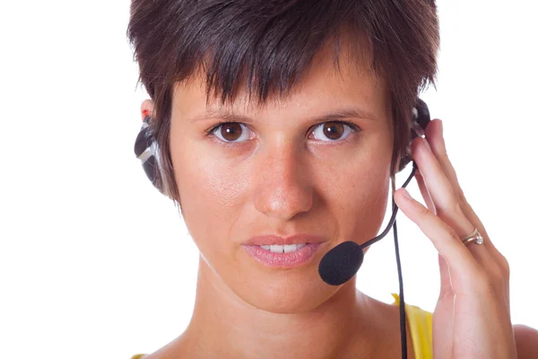 Vrolijke receptioniste met headset — Stockfoto