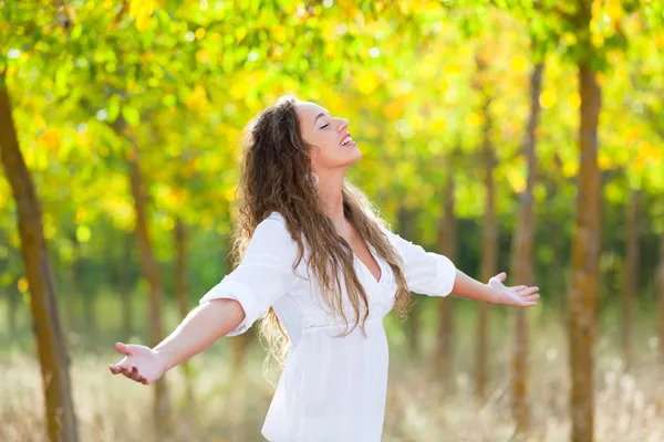 Young Woman Outside with Open Arms, Freedom Sensation Stock Photo