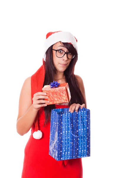 女人与圣诞老人帽子和圣诞礼物 — 图库照片
