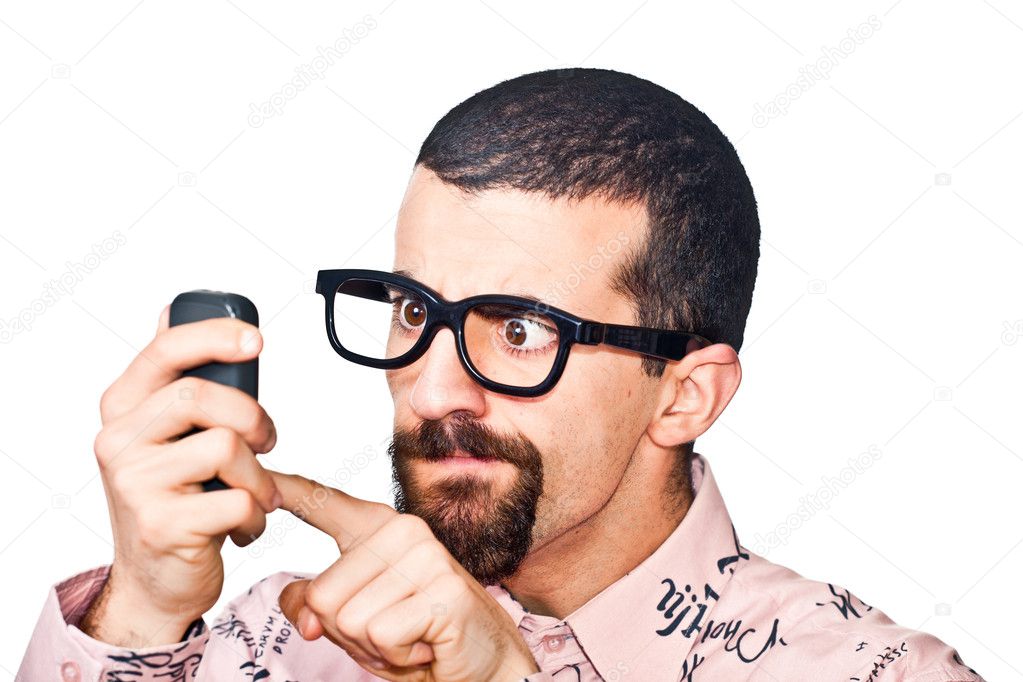 Young Doubtful Man Typing on Mobile
