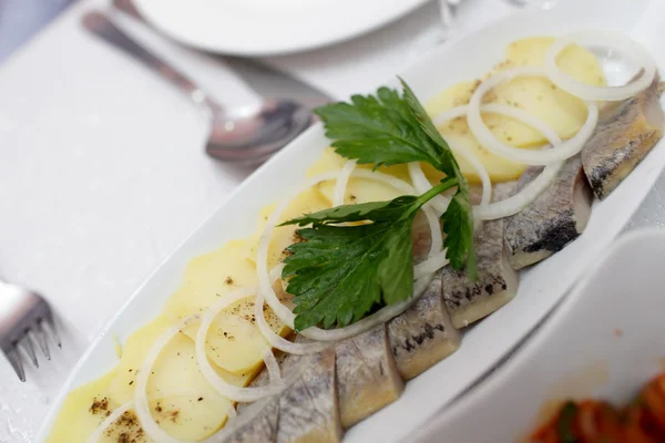 Slices herring and potatoes — Stock Photo, Image