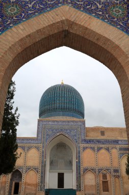 View on Guri Amir mausoleum through arch clipart