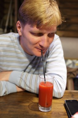 Man drinking tomato juice clipart