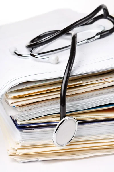 Stethoscope on the stack of paper — Stock Photo, Image