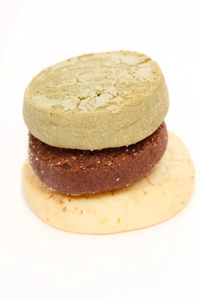 Çikolata, kurabiye yeşil çay ve limon kabuğu — Stok fotoğraf