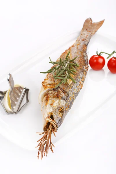 Fish with lemon and cherry tomatoes — Stock Photo, Image