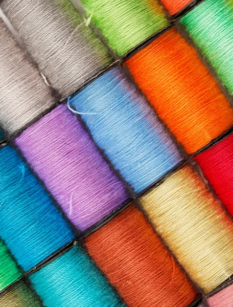 Bobbin of lurex thread — стоковое фото