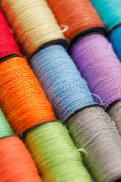 Bobbins of lurex thread — Stock Photo, Image