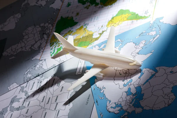 Airliner with a maps — Stock Photo, Image