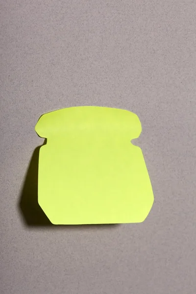 Etiqueta engomada verde lechuga en blanco en una pared — Foto de Stock