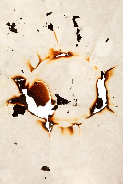 Burn hole in paper — Stock Photo, Image