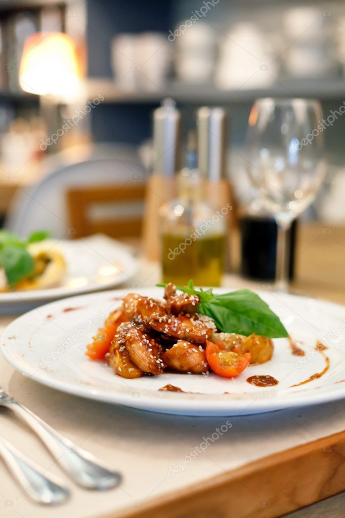 Portion of sesame chicken served on a white plate