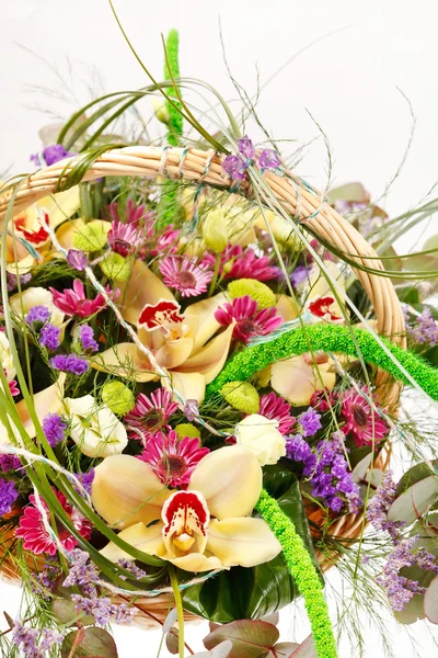 Beautiful flowers in a basket — Stock Photo, Image