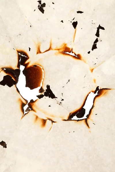Burn hole in paper — Stock Photo, Image