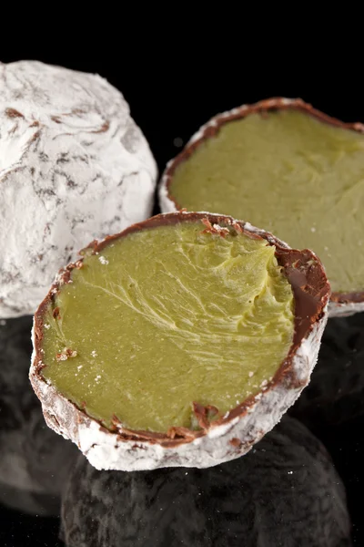 Chocolate truffle with green tea — Stock Photo, Image