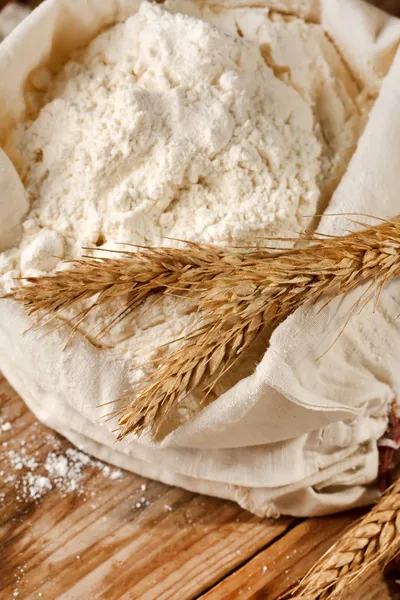 Whole flour with wheat ears — Stock Photo, Image