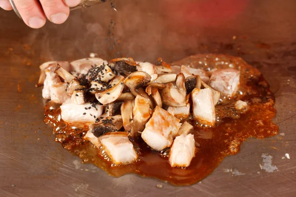 Chef frying meat in a pan — Stock Photo, Image