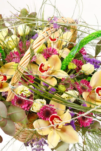 Beautiful flowers in a basket — Stock Photo, Image