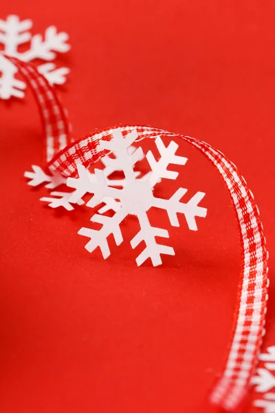 Snowflakes on the red background — Stock Photo, Image