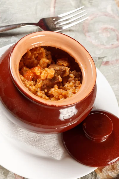 Rice with meat in the pot — Stock Photo, Image
