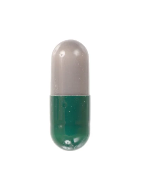 Píldora en el fondo blanco — Foto de Stock