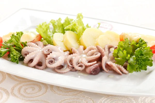 Octopus med kartofler - Stock-foto