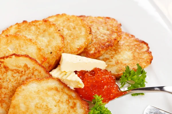 Fried potatoes pancakes with caviar — Stock Photo, Image