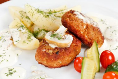 Cutlets with fresh vegetables clipart