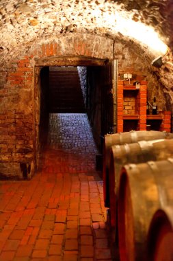 Old wine cellar with barrels clipart