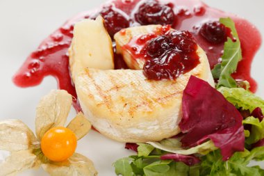 Camembert with cherry sauce clipart