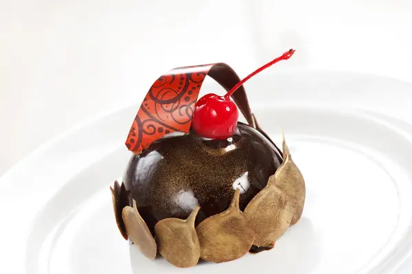 Chocolate pastry with cherry — Stock Photo, Image