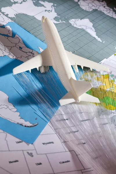 Airliner with a maps — Stock Photo, Image