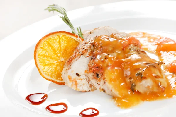 Chicken with orange sauce — Stock Photo, Image