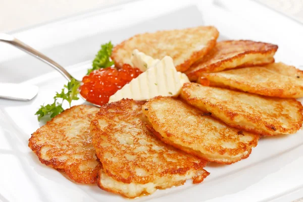 Fried potatoes pancakes with caviar — Stock Photo, Image