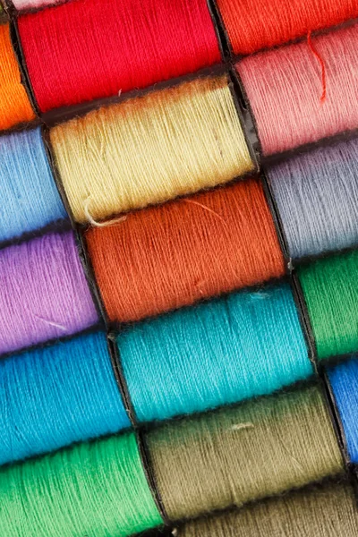 Bobbin of lurex thread — стоковое фото