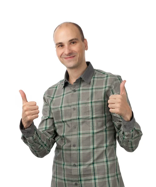 Mladý muž zobrazeno palec nahoru a usměvavý — Stock fotografie