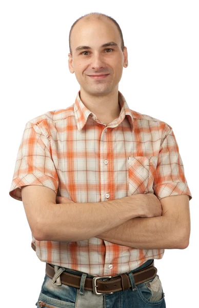 Portrait of happy young man smiling with arms crossed — Stock Photo, Image