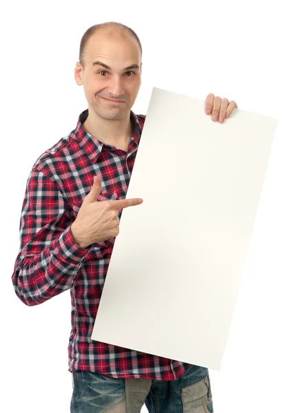 Handsome young man pointing at a blank billboard — Stockfoto