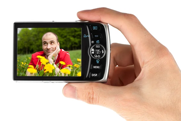 Digitale camera in een hand — Stockfoto