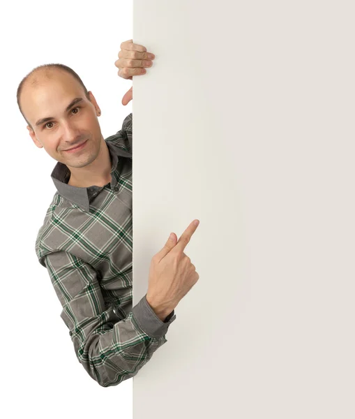 Hombre apuntando a un tablero en blanco — Foto de Stock