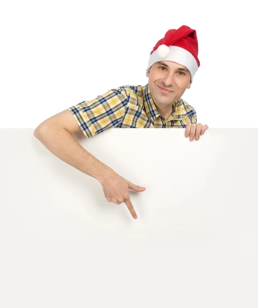 Uomo in cappello Babbo Natale con un segno in bianco — Foto Stock