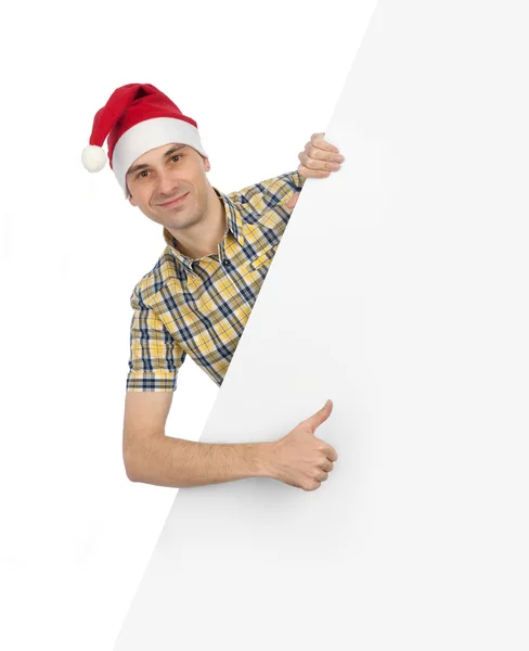 Ragazzo sorridente in cappello di Babbo Natale con cartellone bianco — Foto Stock