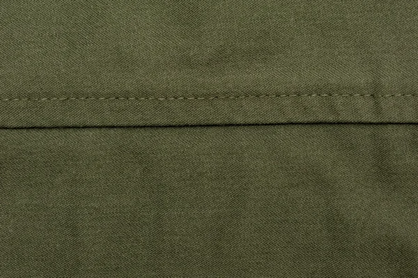 Зеленая швейная ткань — стоковое фото
