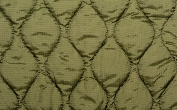 Tecido de costura verde — Fotografia de Stock